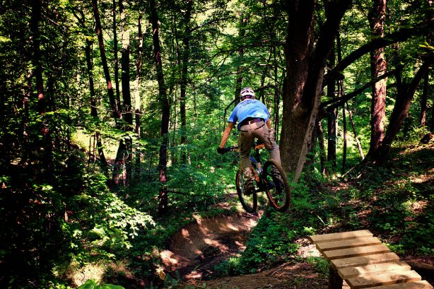 Daniel Goldbach jumps into the chasm at the Harmonie State Park Mountain Bike Trail