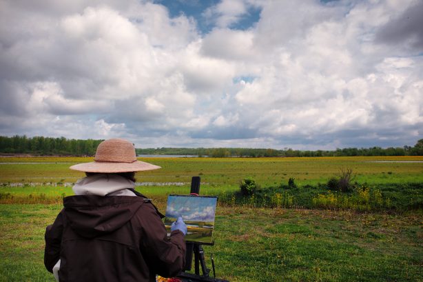 Artist painting Wabash River Scene